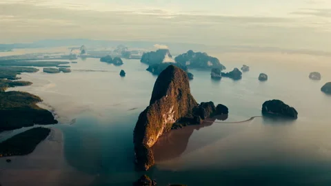 Flying over a mountain cliff in the ocean Stock Footage 297126251