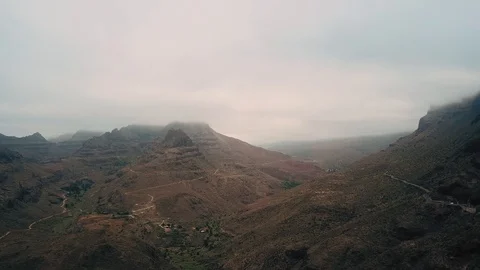 Flying over mountain cliffs. Majestic nature landscape with foggy mountain peaks Stock Footage 94112196