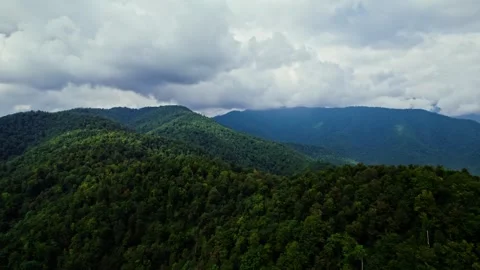 Flying over a mountain with forest in Georgia at a daytime. cloudy Stock Footage 252736406