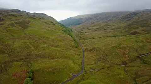 Flying over the mountain gorge between Ardchattan and Barcaldine surrounded by Stock Footage