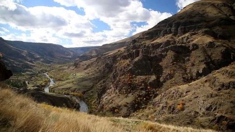 Flying over the mountain gorge. The road along the river, in the woods Stock Footage 82795701