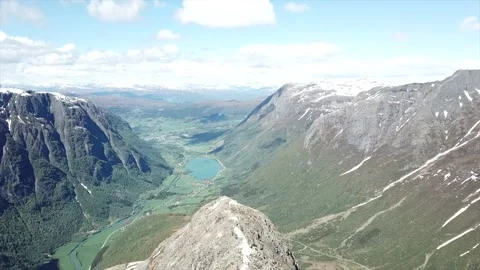Flying over mountain peak against epic view Stock Footage 157883870