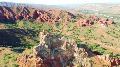 Flying over Mountain Peak and Red Rocks Stock Footage 247955105