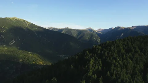 Flying over mountain range in Pyrenees. Village on the green hill 스톡 동영상 131390102