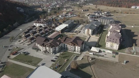 Flying over mountain resort Crystal in Bakuriani. Modern hotel in mountains. Stockbeeldmateriaal 142863560