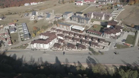 Flying over mountain resort Crystal in Bakuriani. Modern hotel in mountains. Stockbeeldmateriaal 142863963