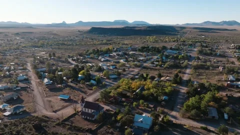 Flying over mountain to reveal small rural West Texas Town, Fort Davis near Big Stock Footage 297456266