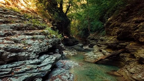 Flying over a mountain river Beautiful views of the water in the mountain canyon Video stock 116276215