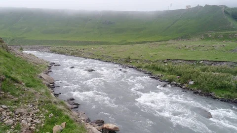 Flying over a mountain river at the bottom of a deep gorge. Aerial view. Stock-Footage 91031410