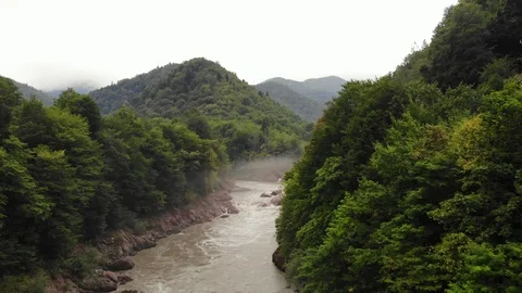 Flying over the mountain river with fog. Stock Footage 118159944