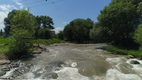 Flying over a mountain river, a strong stream of water. From the air Video stock 86266829