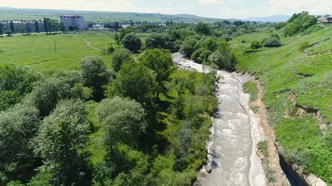 Flying over a mountain river, a strong stream of water. From the air Video stock 86266858