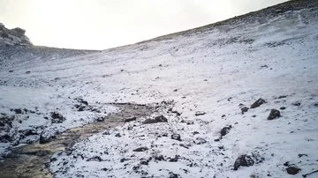 Flying over mountain river in winter river direction Video stock 85523655