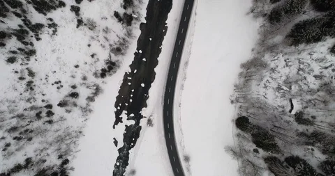Flying over a mountain river in winter. Switzerland. Stockbeeldmateriaal 92617073