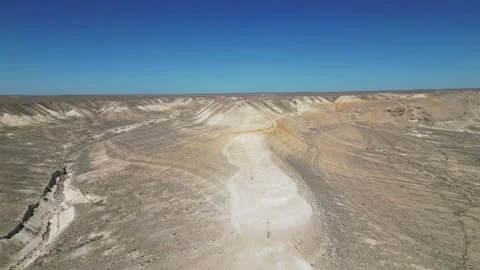 Flying over a mountain road with a beautiful blue sky Stock Footage 237743610