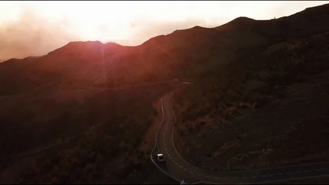 Flying over a mountain road at sunset in Madeira Stock Footage 103323764