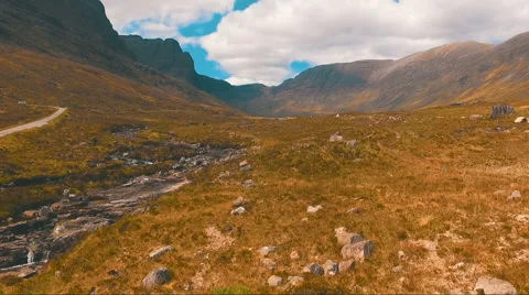 Flying over the mountain stream Video stock 63808825