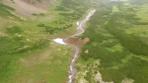 Flying over a mountain stream. Waterfall Stock Footage 72561506