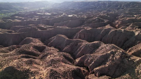 Flying over the mountainous desert of Gorafe, Granada, Spain Stock Footage 314109151