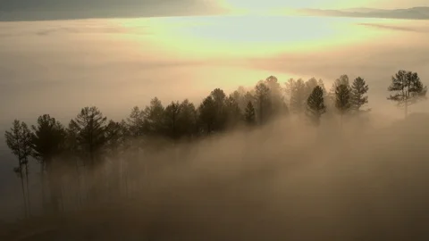 Flying over the mountains above the clouds. Misty morning.Aerial View Stock Footage 123106074