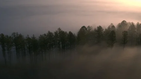 Flying over the mountains above the clouds. Misty morning.Aerial View Stock Footage 123106171