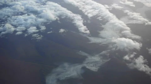 Flying over the mountains and clouds at sunset. Amazing view Stock Footage 122102465