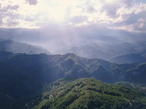 Flying over mountains and forest Stock Footage 75311751