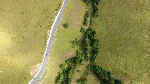 Flying over the mountains and road Stock Footage 66418776