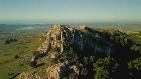 Flying over the mountains covered with beautiful green pine forests. Stock Footage 292572771