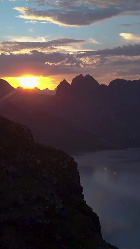 Flying over the mountains at dawn Video stock 257772229