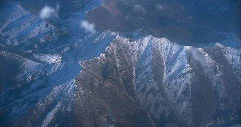 Flying over the mountains with snow. Stock Footage 119666479
