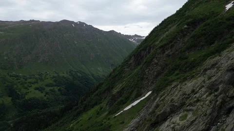 Flying over the mountains in spring Stock Footage 305512674