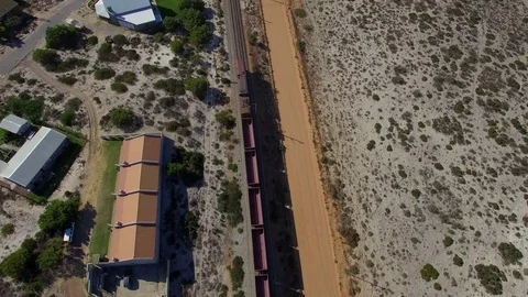 Flying over Moving Train on Beach Coast, South Africa Aerial View Stock Footage 79746782