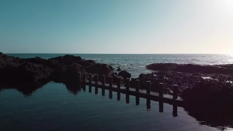 Flying over natural pool Atlantic ocean Stock Footage 125434256