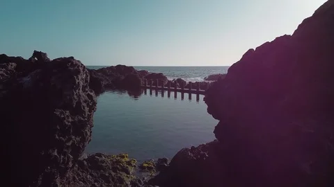 Flying over natural pool Stock Footage 125432975