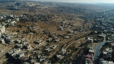 Flying over north part of Bethlehem toward Har Homa of Jerusalem. DJI_0082-04 Video stock 104496579