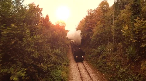 Flying over nostalgic steam engine locomotive. retro vintage background Stock Footage 43618571