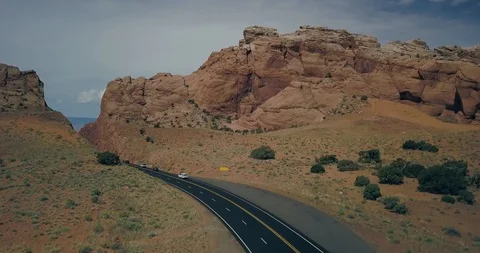 Flying over notch cut into the rocks high above the Arizona desert on hwy 89 Video stock 119120485