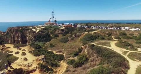Flying over the ocean and the cliffs near the lighthouse Stock Footage 62770319