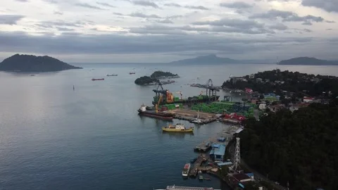 Flying Over Ocean and Ship Yard Stock Footage 168953588