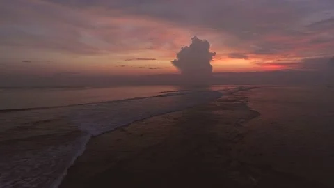 Flying over the ocean in the beautiful and bright sunset light. Stock Footage 148472002