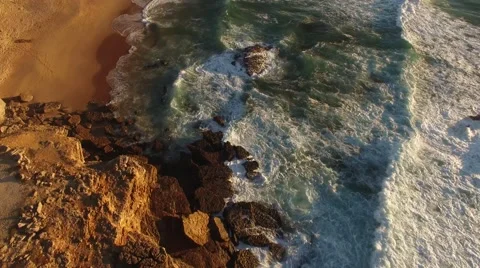 Flying over the ocean cliffs at sunset aerial Guincho Portugal Stock Footage 68656524