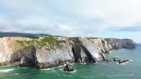 Flying Over The Ocean Rocks of the Coast Stock Footage 289663773