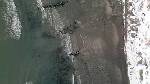 Flying over ocean, sand and snow Stock Footage 232505745