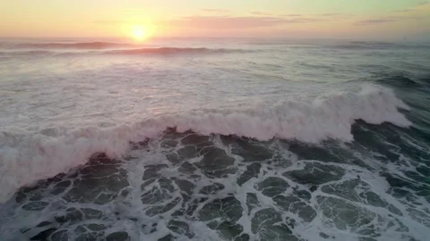 Flying over the ocean wave during sunset. Aerial view of sea or ocean surf Stock Footage 162815188
