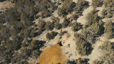 Flying over old abandoned mine shaft on hillside-Aerial Video stock 219378070