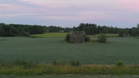 Flying over an old barn at field. Stock Footage 134800873