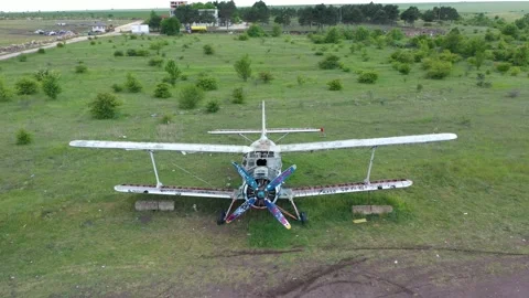 Flying over an old broken abandoned airplane wreck. 4K Stock Footage 197512410