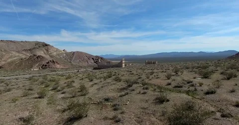 Flying over old ghost town of Rhyolite, Nevada near Death Valley Stock Footage 72969690