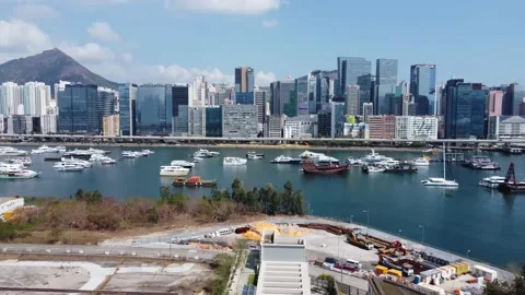 Flying over from Old Kai Tak Airport (now Cruise Terminal) to Kwun Tong CBD Stock Footage 148378652